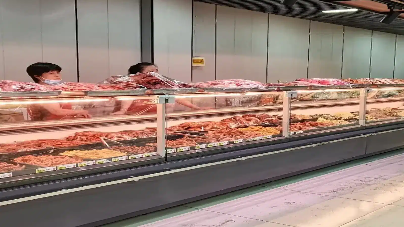 Flat-glass deli showcase base and service-counter detail