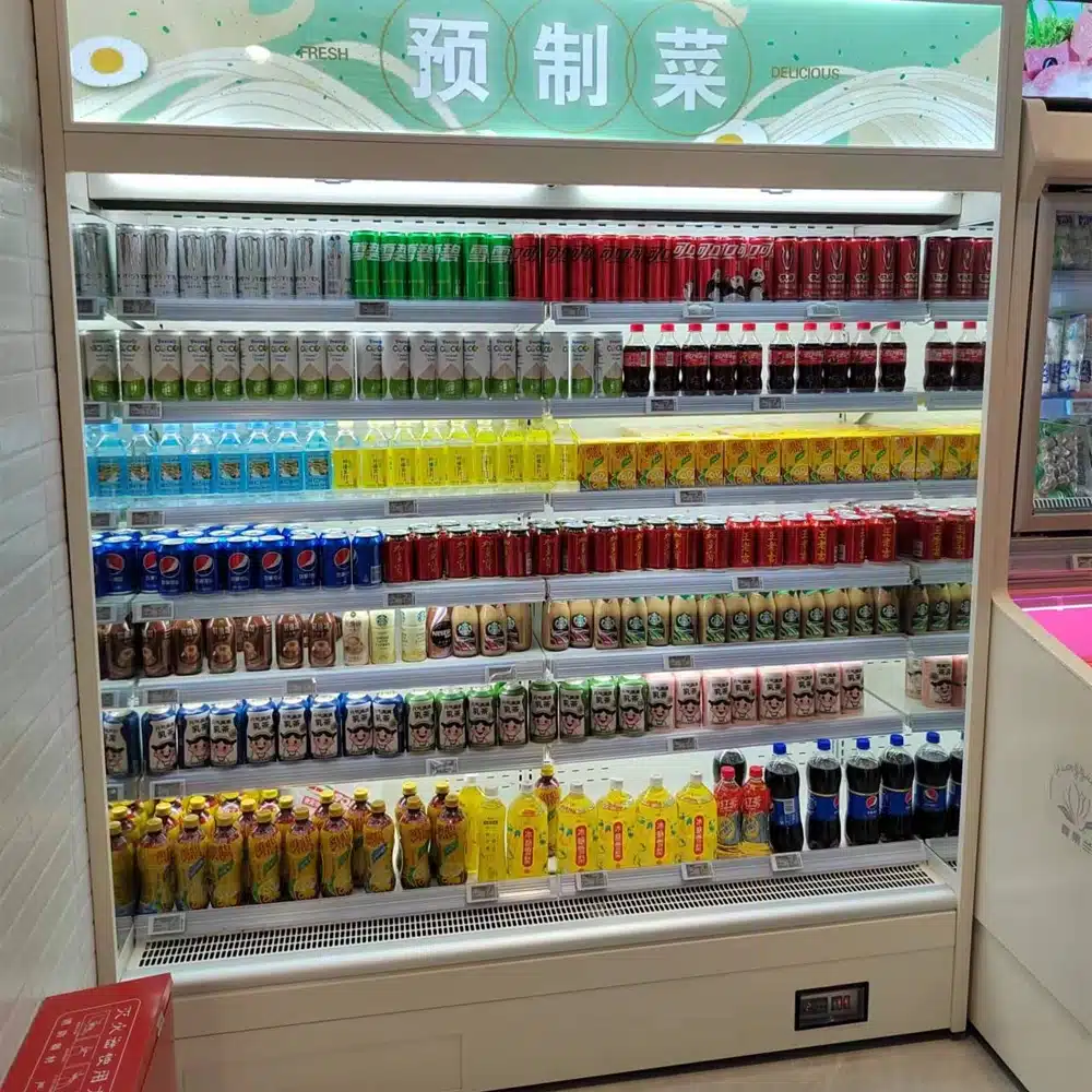 Plug-in multideck open chiller for beverage display with integrated "Easy-Clean" condenser base, self-evaporating drainage, and precision 0 to 5°C cooling - XCCold Series