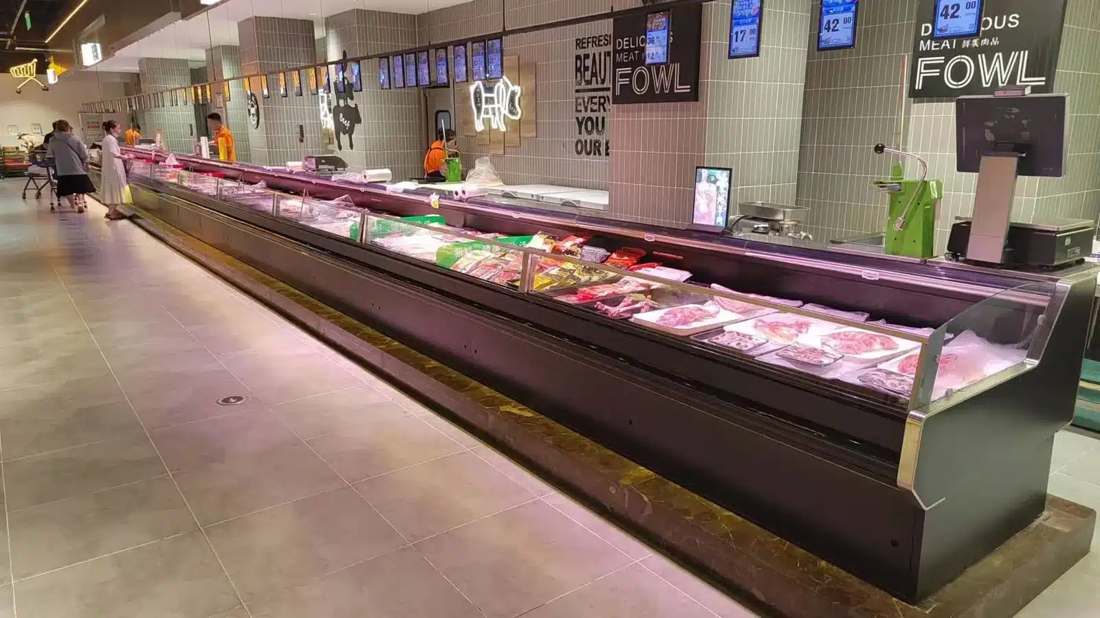 Remote fresh meat showcase counter in a retail meat department