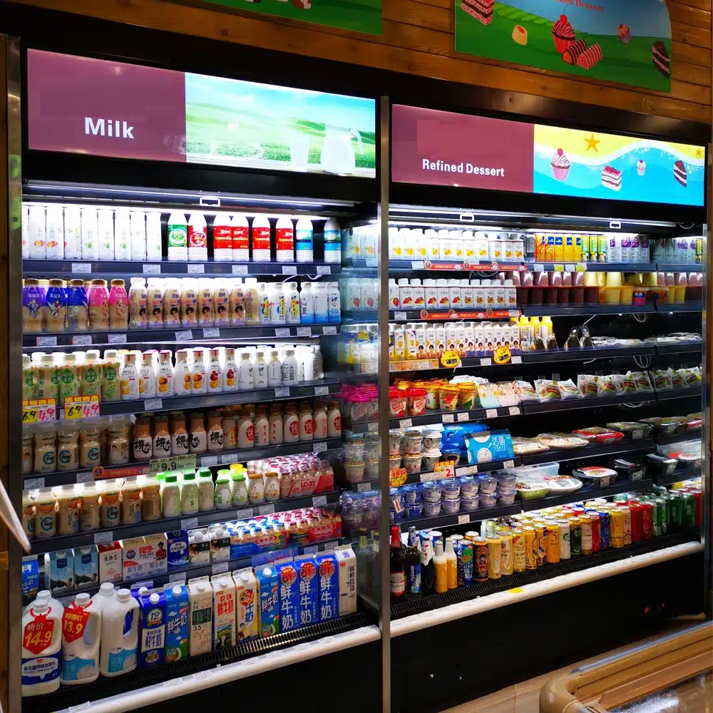 Vertical multideck open fridge for dairy products featuring high-velocity "Thermal-Shield" air-curtain, heavy-duty reinforced shelving, and precision 0 to 5°C remote cooling - XCCold Series