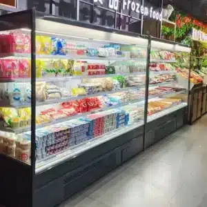 Vertical open-front multi-deck refrigerator with integrated bottom-mounted compressor, front-ventilation base, and precision 0 to 5°C "Plug-and-Play" cooling - XCCold Series